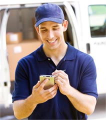 exel worker checking handheld device and smiling
