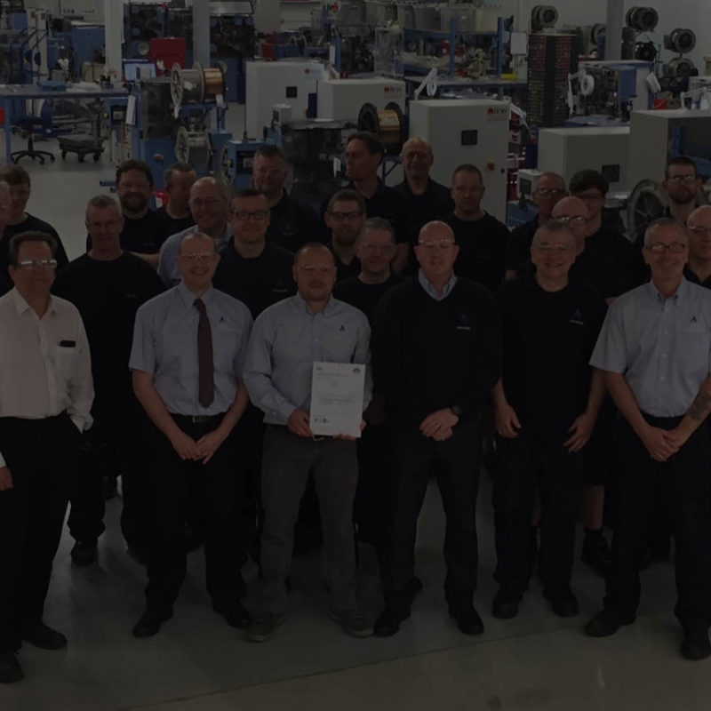 Exel client - Advanex team photo in factory